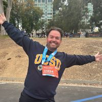 Ricardo Altamirano smiling with outstretched arms