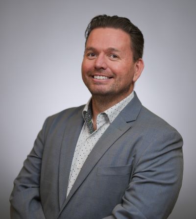 Ricardo Altamirano posing in a business suit for a portrait photo