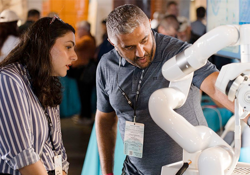 Alan Moazzam, an assistant professor at UC San Diego School of Medicine and member of the AirSurgical team, talks an Innovation Day attendee