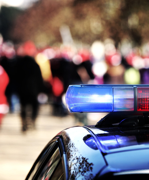 police car in front of crowd