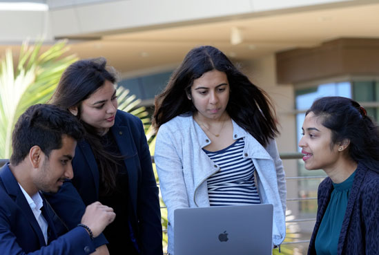 Students working together around table