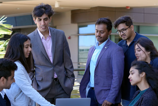 Students working together around table